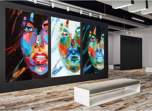 a gallery with three women painting