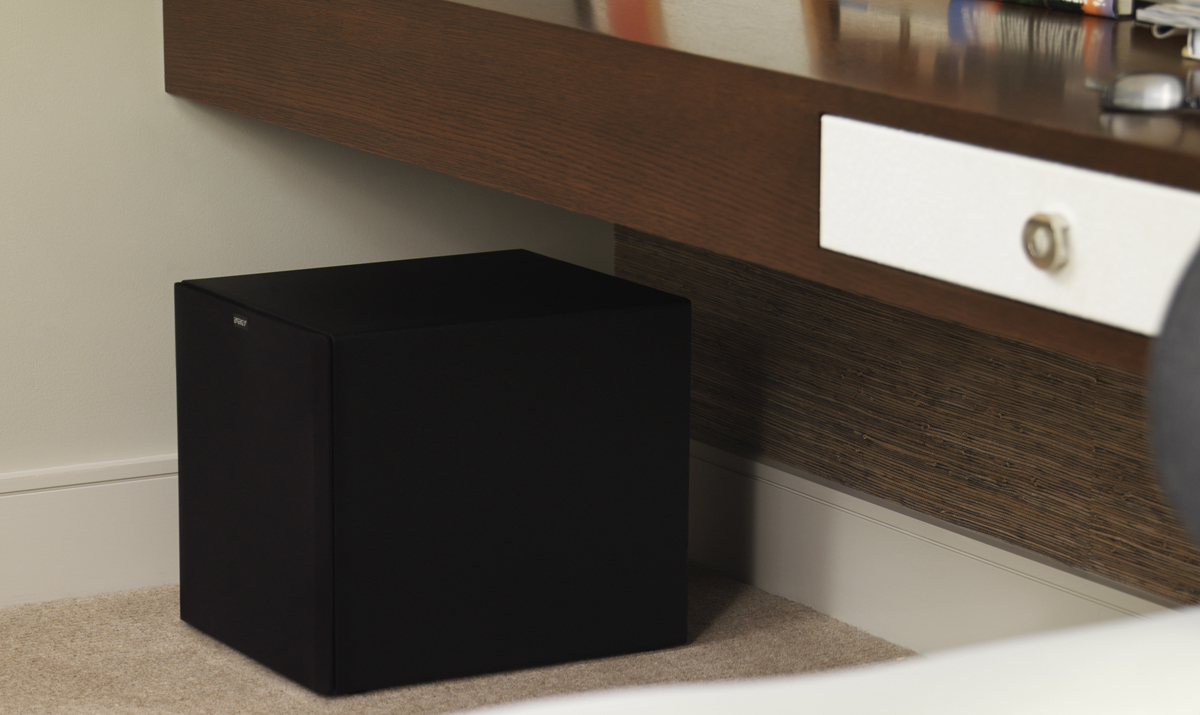 The subwoofer is placed under a counter which does not take up much space