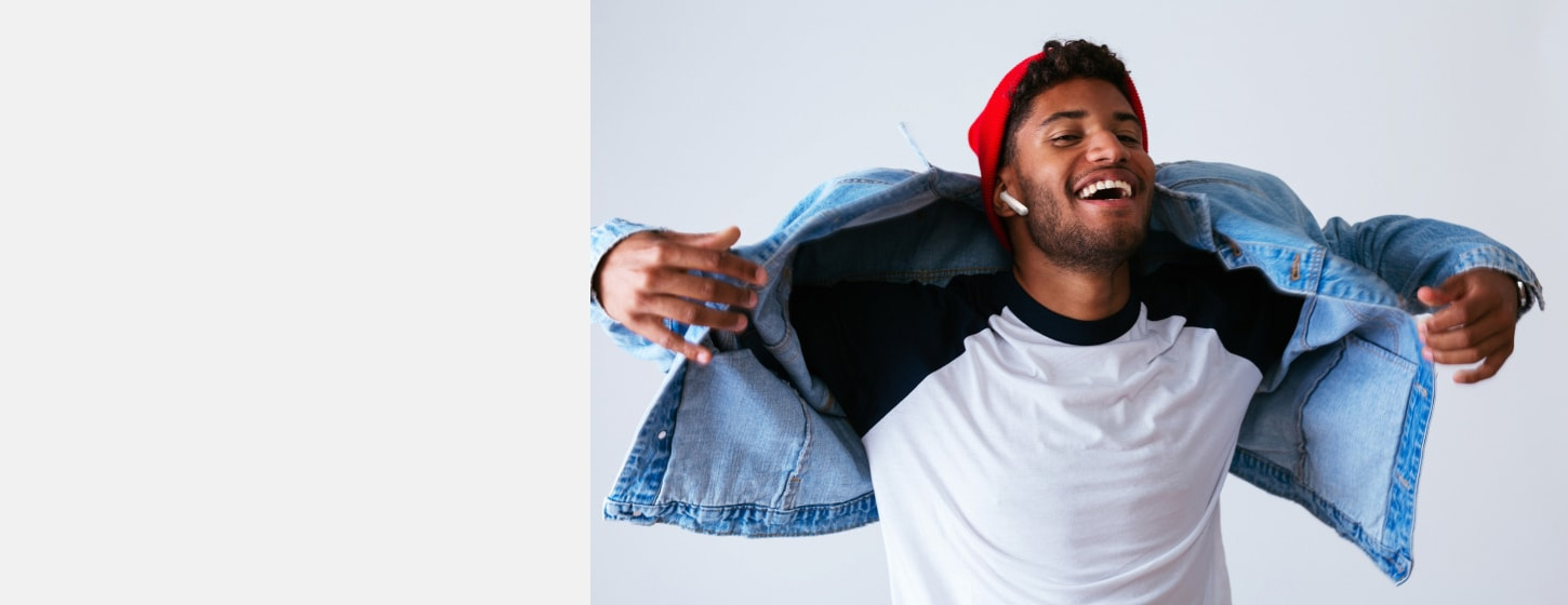 A man wears JBL TUNE 220TWS True wireless earbuds