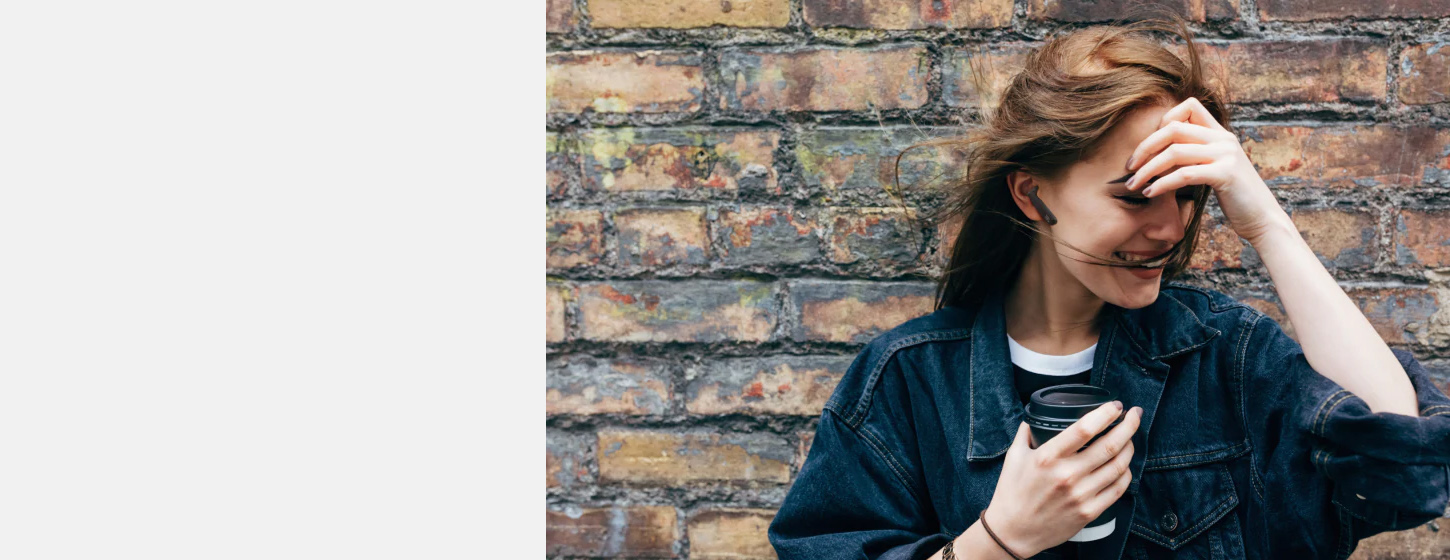 A girl wears JBL TUNE 220TWS True wireless earbuds