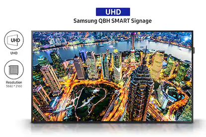 UHD Samsung QBH Smart Signage Display with 4K Resolution Showing an Overhead Image of a City Skyline Lit Up Next to a River