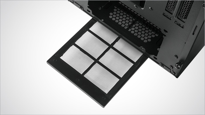 The PSU Dust Filter sticking out of the bottom of the Rosewill RISE case