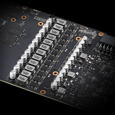 Partial view of a graphics card PCB, showing a slew of capacitors, chokes and MOSFETs
