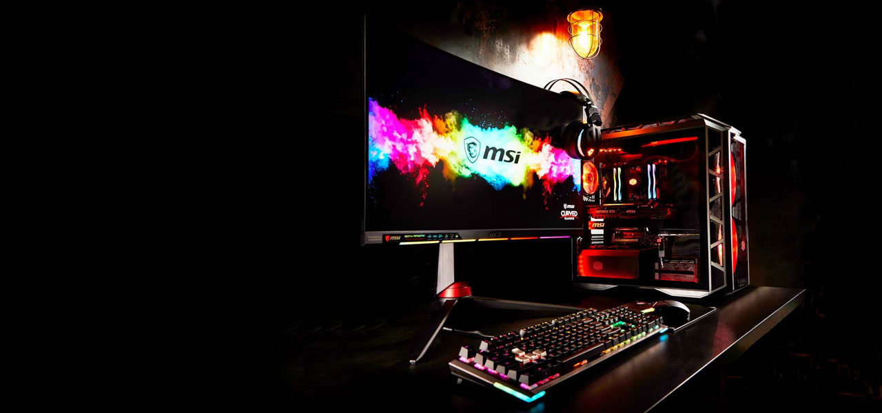 A RGB-lit gaming rig, with large logo displayed on the monitor
