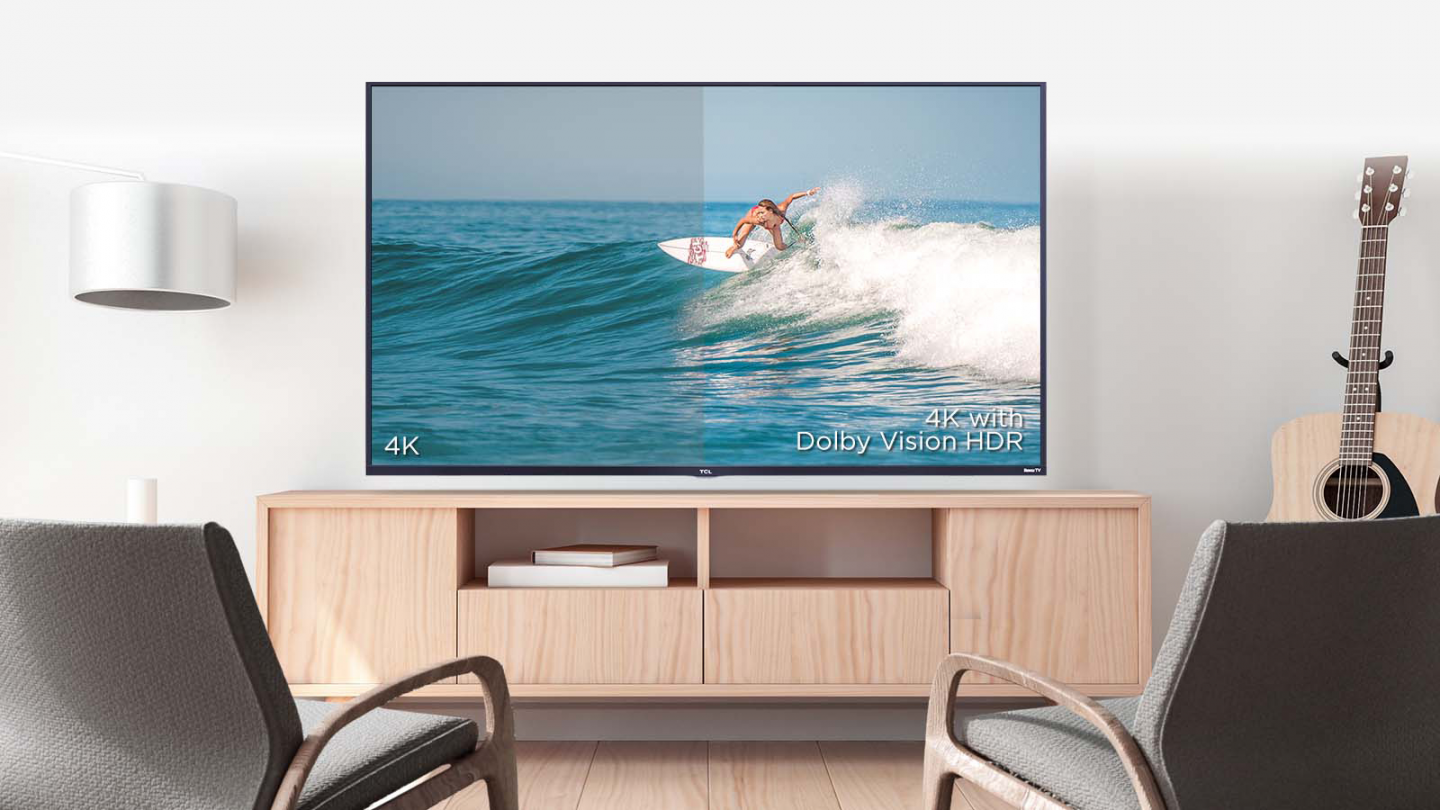 TCL 65S517 smart LED TV hangs on the wall of the TV cabinet