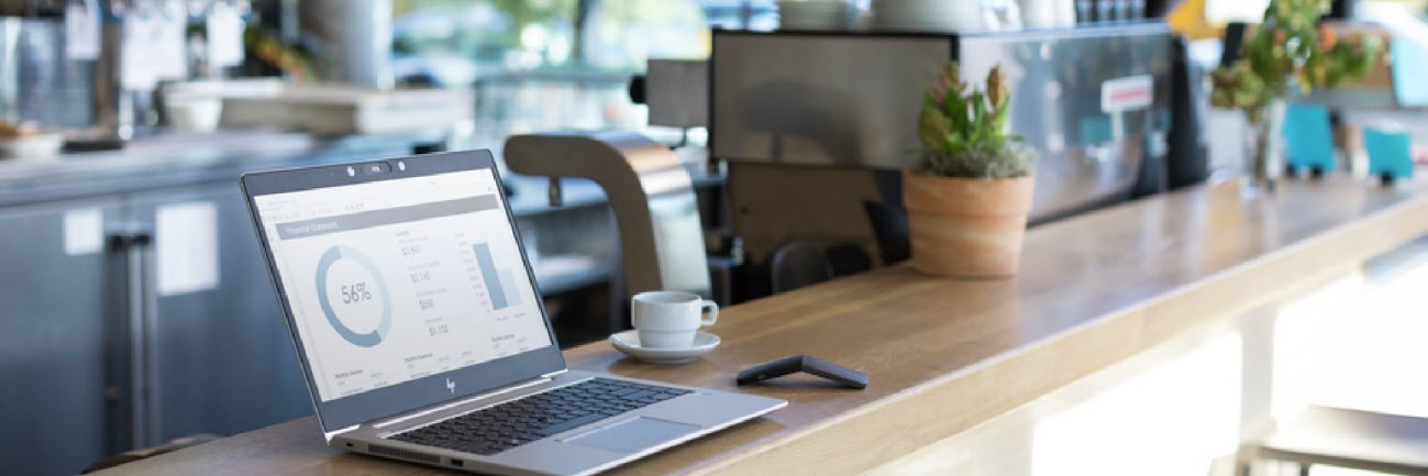 Open HP EliteBook on a Coffee-Shop Counter