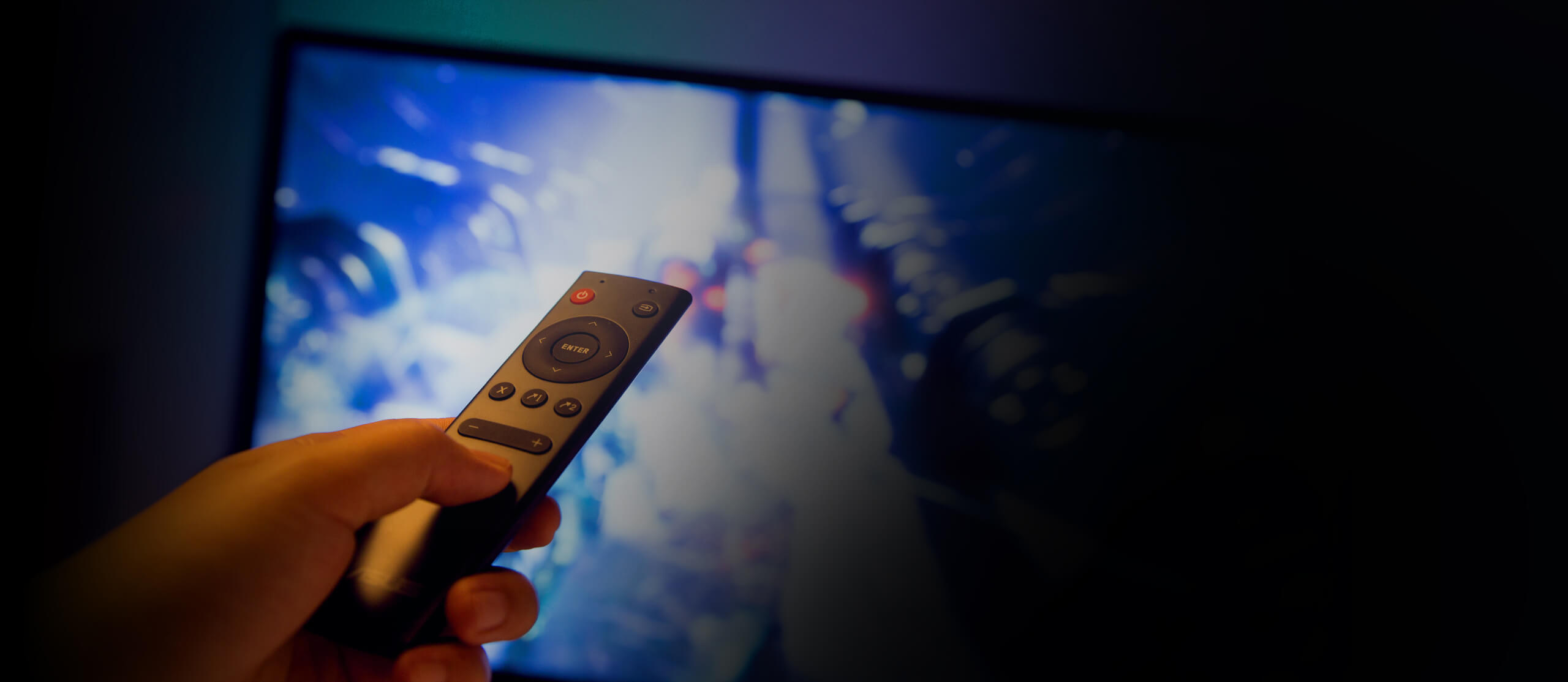 a hand is using remote control