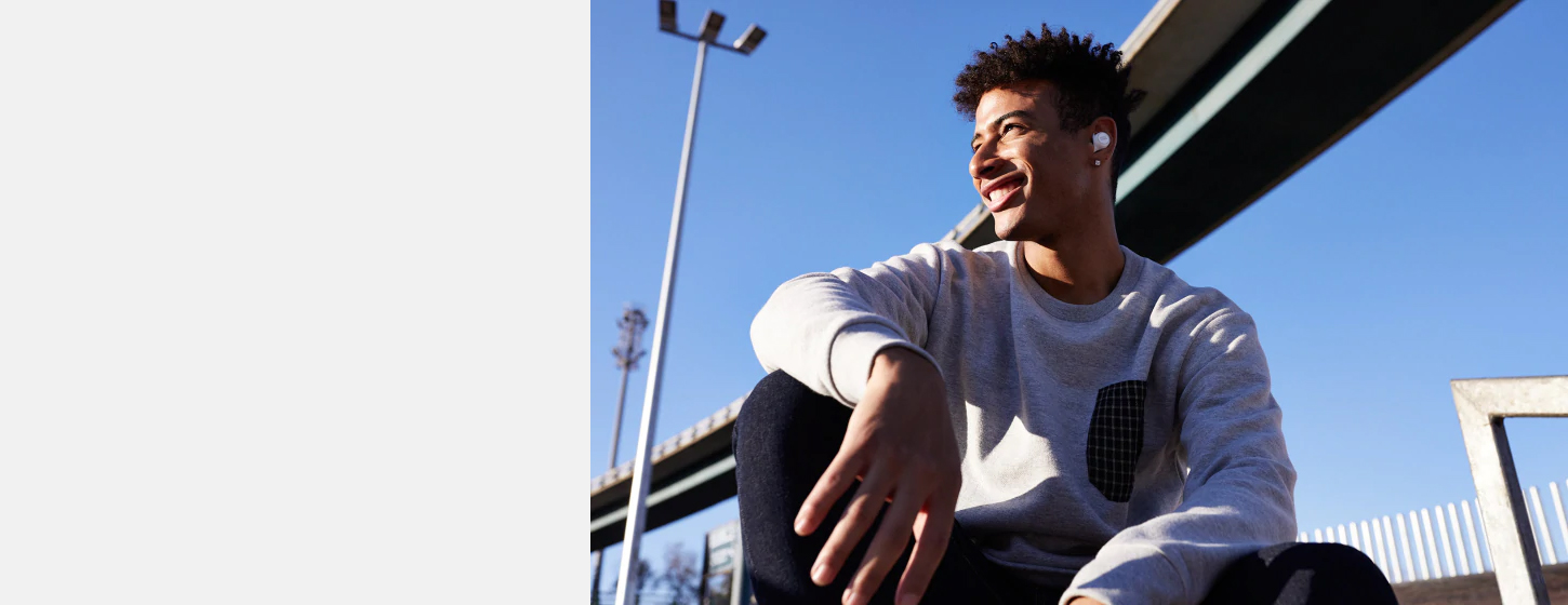 A boy wears JBL LIVE 300TWS True wireless in-ear headphones