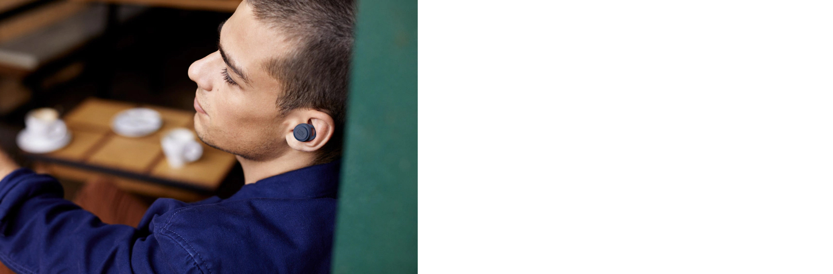 A boy wears JBL LIVE 300TWS True wireless in-ear headphones