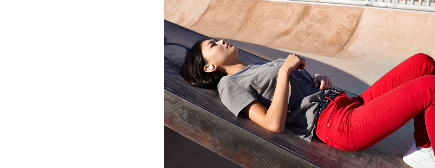 A girl wears JBL LIVE 300TWS True wireless in-ear headphones