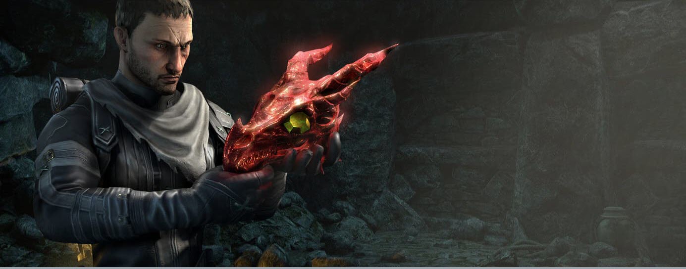 a man holding the red skull of a dragon