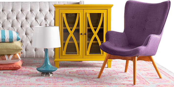 Pillows, chair, lamp and cabinets are displayed