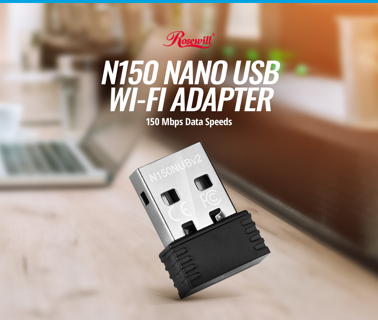 Rosewill RNX-N150NUBv2 NANO USB WI-FI ADAPTER 150 Megabits per second Data Speed tilted up to the right on a kitchen counter in front of a laptop