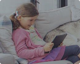 A young girl using a tablet