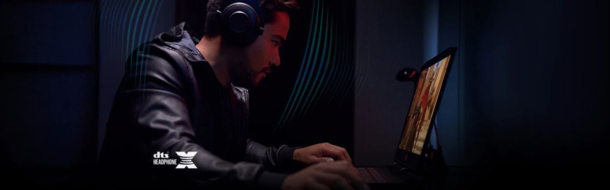 A man is pressing keys while wearing a headset
