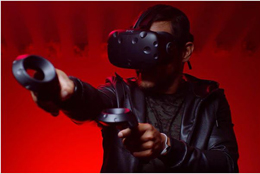A man has VR headset worn and VR controllers in the hand