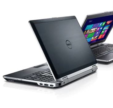 Two Open Dell Laptops Slightly Open Facing Left and Right behind one another