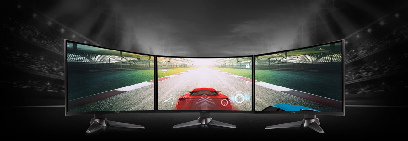 a car racing image crossing three monitors as screen