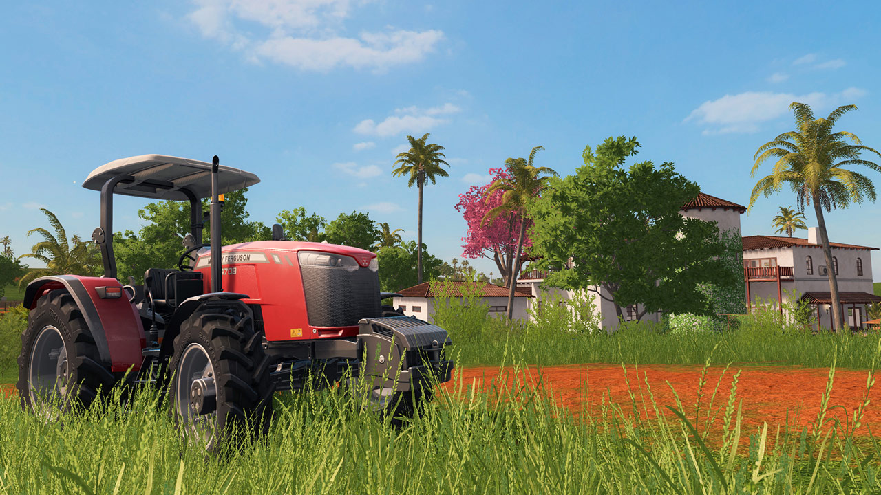 A red tractor next to a South American villa