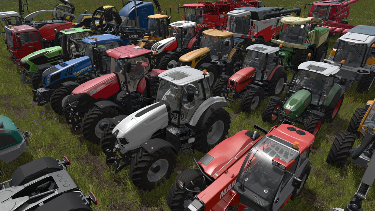 A collection of farm vehicles on grass