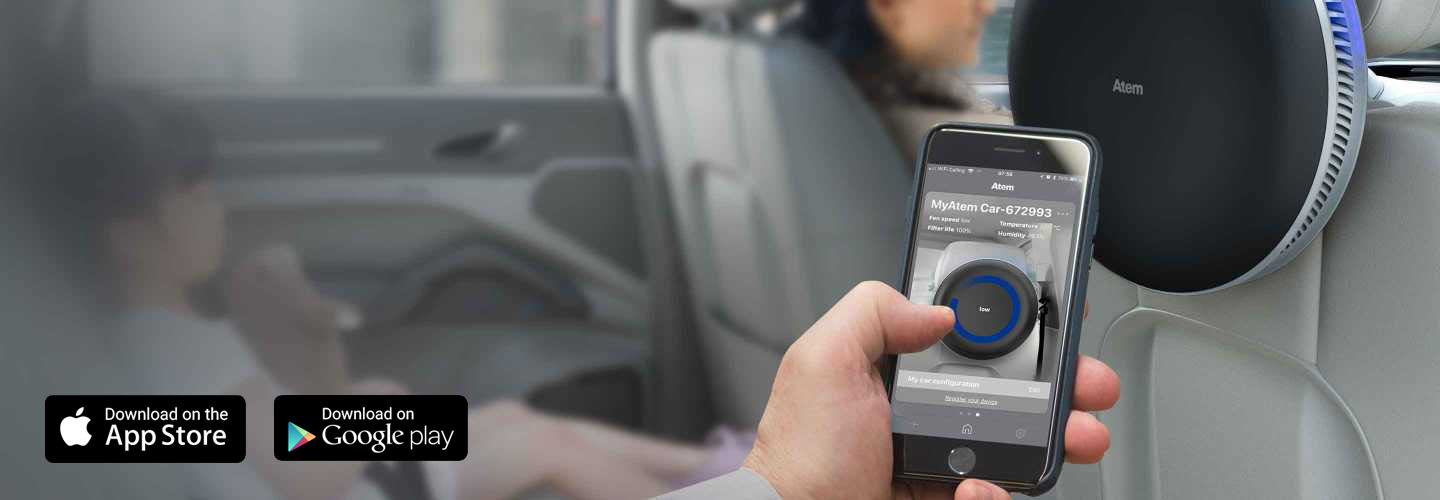 Atem mobile app being used on a smartphone being held by a hand from a passenger in a car. The App Store and Google Play logos are in the left corner