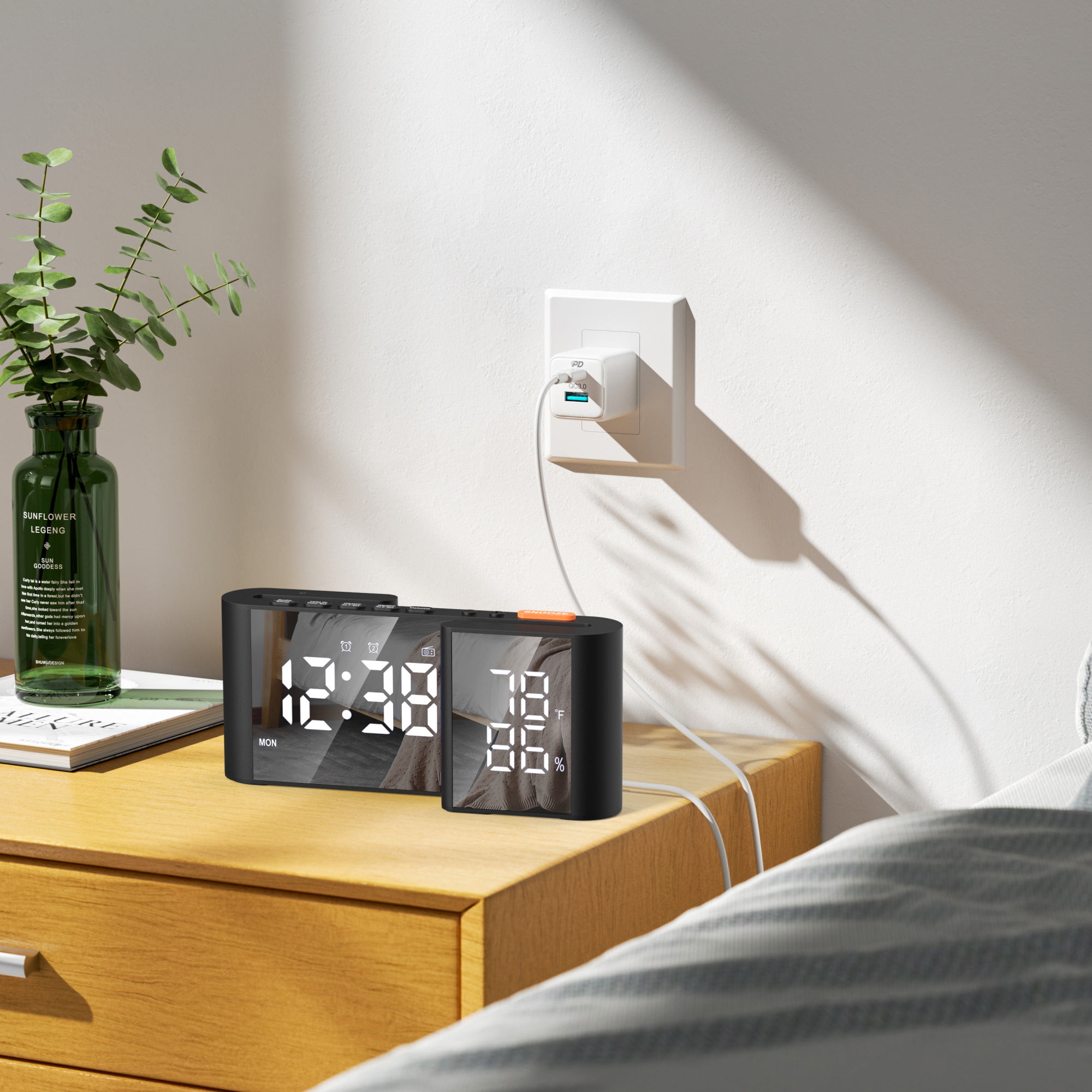 Unique S-shaped Digital Alarm Clock on the bed-table