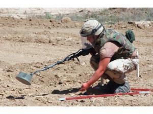 US Army Private uses a metal detector to mark land mines and unexploded ordnance Poster Print by Stocktrek Images (17 x 11) US Army Private uses a metal detector to mark land mines and unexploded ordnance Poster Print by Stocktrek Images (17 x 11)