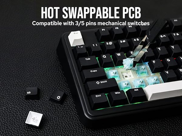 Mechanical keyboard with hot swappable PCB, compatible with 3/5 pin switches. Close-up shows illuminated key switches being removed or inserted, demonstrating the hot-swap feature.