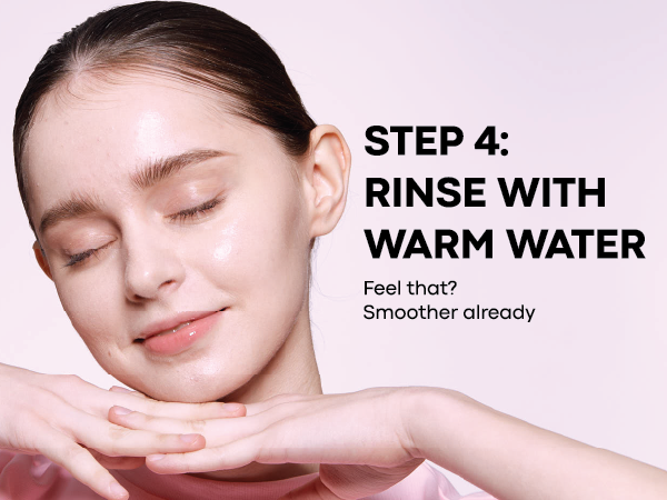 Step 4 - Rinse with Warm Water: model with dewy, freshly rinsed skin on pink background