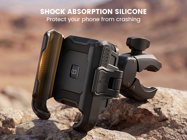 Text reads 'SHOCK ABSORPTION SILICONE Protect your phone from crashing'. Device mount shown on rocky terrain demonstrating shock absorption features.