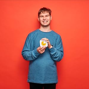 Boy in a blue shirt holding Time Timer MOD 10 Minute visual timer.