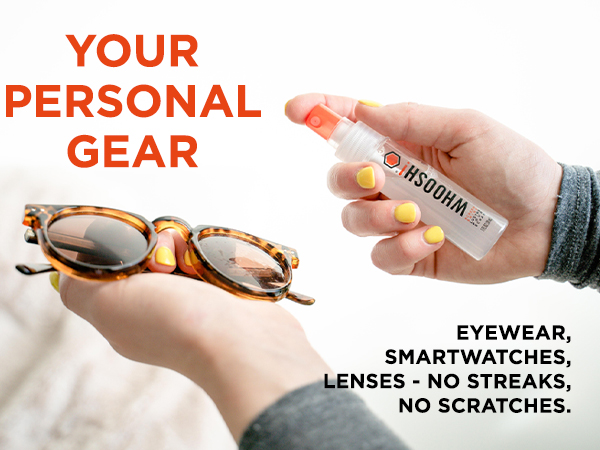 Hands holding tortoise shell sunglasses and a bottle of WHOOSH! screen cleaner for personal gear.