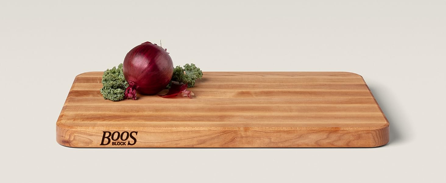 Boos Block Maple Wood Edge Grain Cutting Board with berries on top.