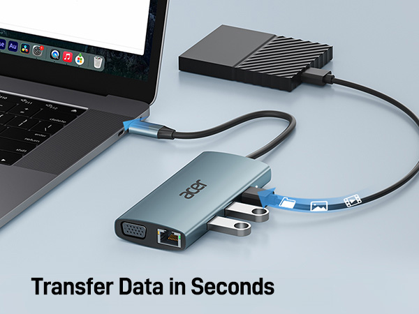 Text reads 'Transfer Data in Seconds'. External hard drive and USB hub connected to laptop, showing data transfer setup with multiple ports and cables.