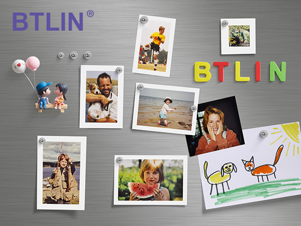 BTLIN brand display featuring colorful magnetic letters and small decorative elements arranged on a metallic grey surface, with photos and children's artwork attached.