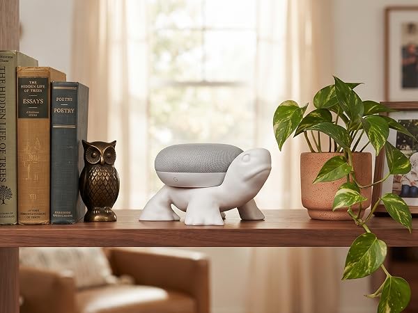White unicorn Echo Dot holder with pink mane and gold horn in a pastel smart-home setting.