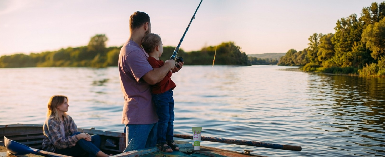 dad and child fishing on a lake