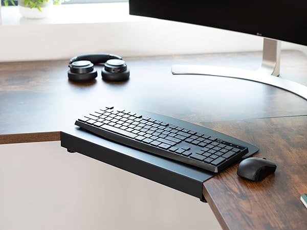 Corner desk setup with keyboard