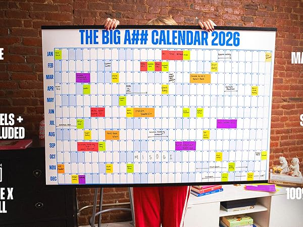 Woman holding a large wall calendar