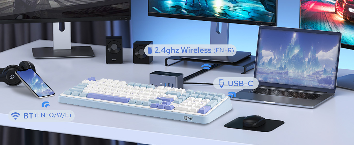 a computer desk with a keyboard, mouse, speakers and a mouse.