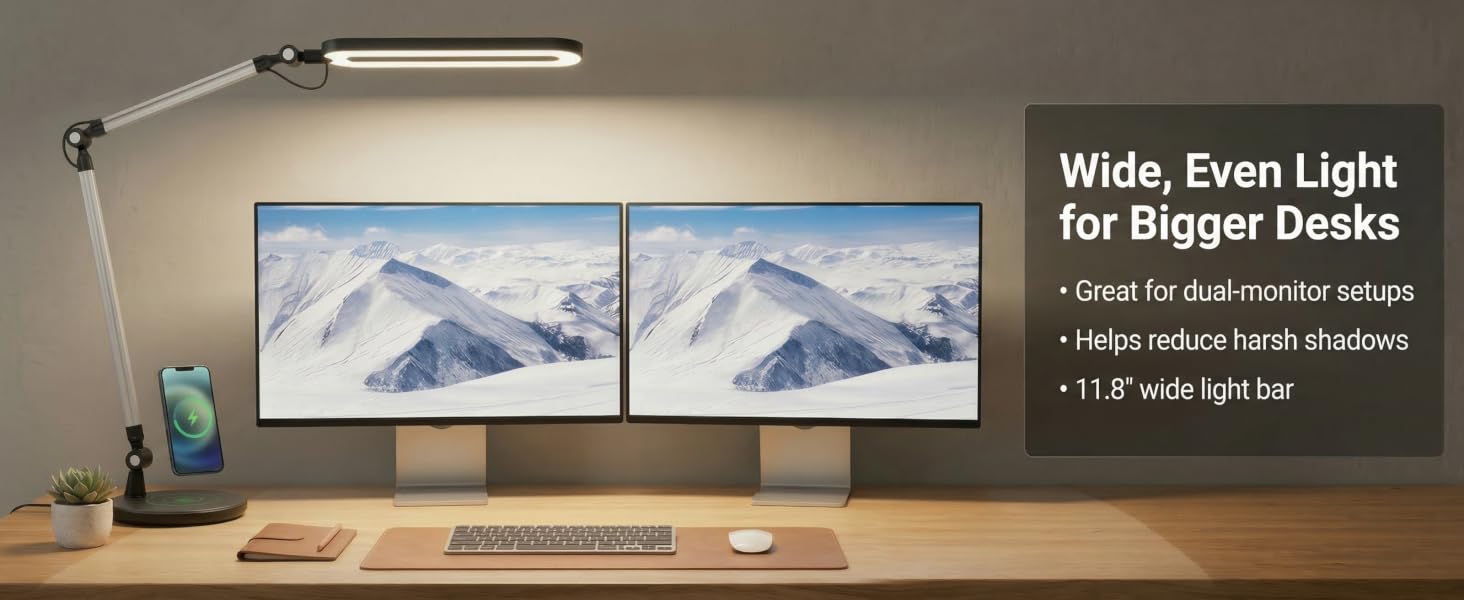LED desk lamp providing wide even lighting across a dual monitor desk setup