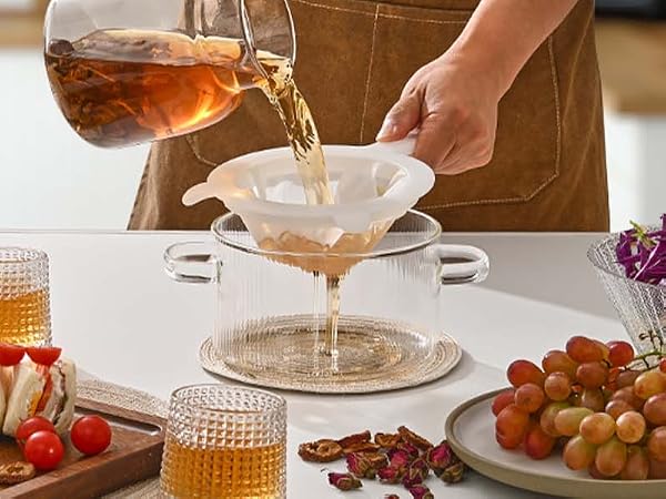 Brew and filter tea, and serve with sandwiches and fruit for afternoon tea
