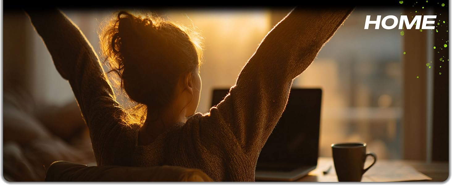 Woman stretching comfortably at home office desk after using ergonomic mouse pad wrist rest