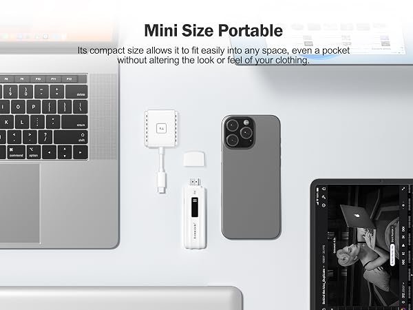 Compact white USB-C hub next to laptop, smartphone, and tablet. Features multiple ports for connectivity and data transfer.