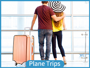 a couple with a suitcase at the airport.