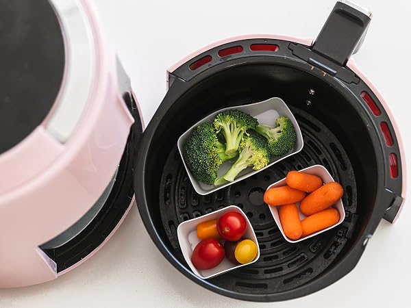 Square and rectangle silicone baking cups in an air fryer with vegetables