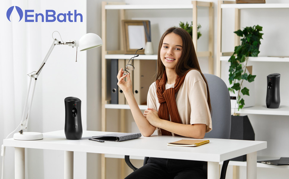 Black automatic air freshener dispenser, wall-mounted or countertop, sleek and compact design.