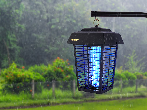Bug zapper with bright blue light outside in rainy weather