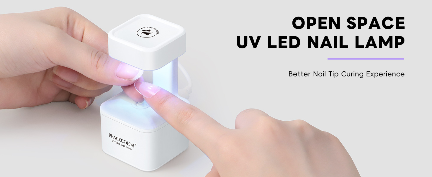 Text reads 'OPEN SPACE UV LED NAIL LAMP'. Demonstration of compact white UV nail lamp device being used to cure nail polish.