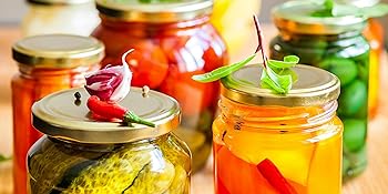 Assortment of filled jars on countertop